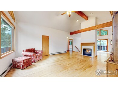Oak flooring, vaulted and beamed ceilings, massive windows and double-sided fireplace make this great room GREAT!