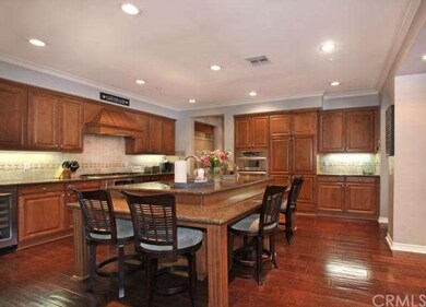 The upgraded kitchen has granite countertops, tumb