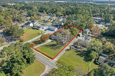 Aerial view of residential area with property boundaries highlighted