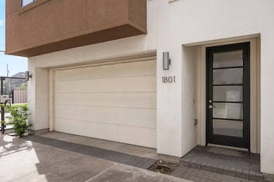 The front porch has a dark stained front door with