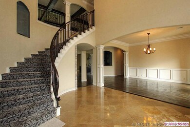 Step through the beautiful wrought iron front door