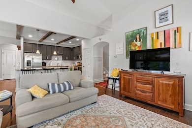 The open floor plan is great for entertaining! Guests can flow easily between the living room, kitchen, and dining area.