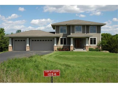 Front view of home during the summer.  Highlights 