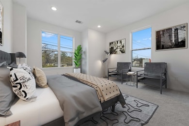 Primary bedroom photo is virtually stage