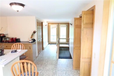 Kitchen area that leads to laundry area