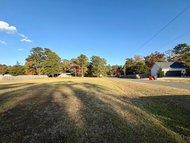 View of yard featuring view of scattered trees