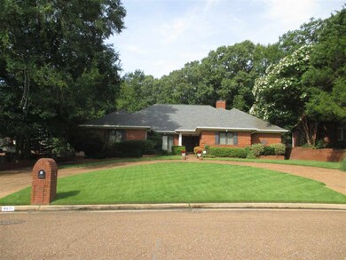 Beautifully landscaped front yard. Home on cove.