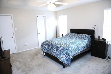 Master Bedroom with baseboards and ceiling fan