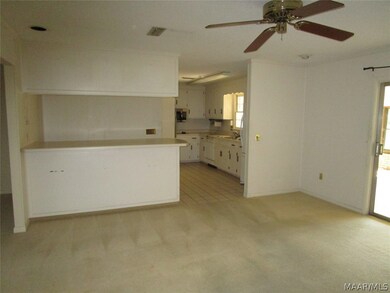 Open floor plan looking at bar area into kitchen