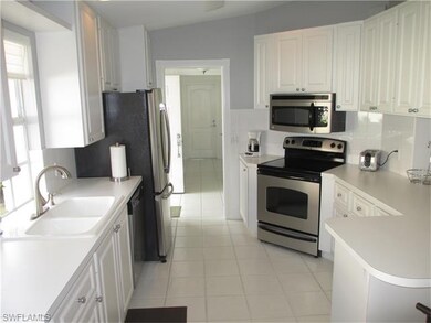 Clean and bright kitchen with newer appliances