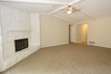 Large living area with newly painted fireplace, va