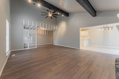 Unfurnished living room featuring hardwood / wood-