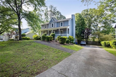 View of front of home featuring covered porch, a c