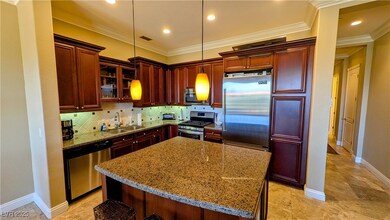 Kitchen with crown molding, stainless steel applia
