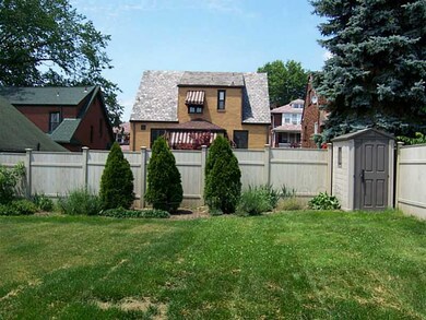 Exterior Back. Spacious, level yard with shed, pri