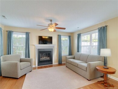 Spacious living room features abundant natural lig