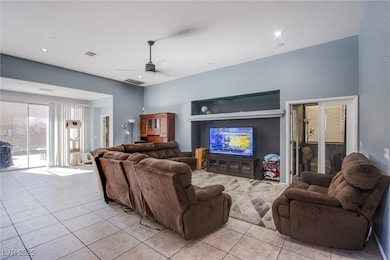 Living room with recessed lighting, ceiling fan, v