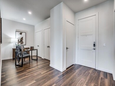 Foyer featuring dark hardwood / wood-style floorin