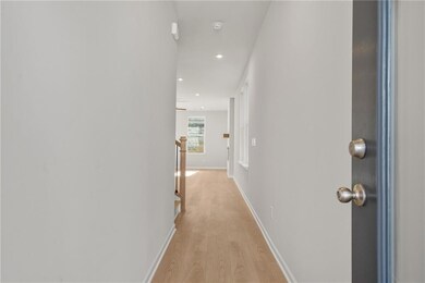 Hallway featuring light wood-type flooring