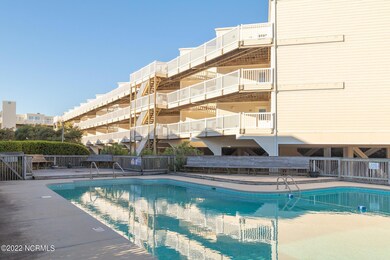 Pool area looking up at condo