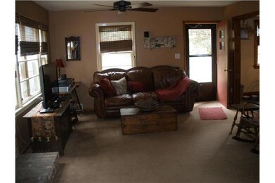 Living Room. Abundant windows with custom shades