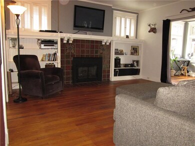 The living room opens to the den/sun room as well 