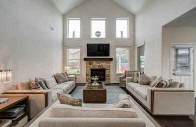 The Family Room features elegant high ceilings to