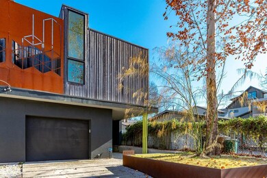 View of property exterior featuring a garage, stu