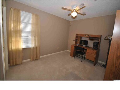 Bedroom 1 with ceiling fan.