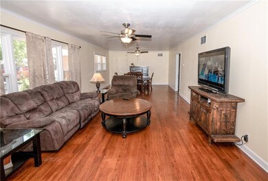 Living area flowing into dining area. Original Woo