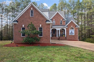 Front facade featuring covered porch and a front y