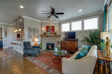 The first thing to catch your eye as you walk in is this stacked stone fireplace. What a fabulous focal point.