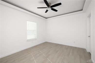 Unfurnished room with light hardwood / wood-style flooring and ceiling fan