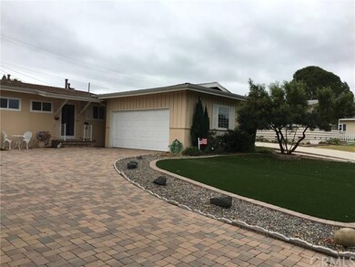Beautiful Paver Driveway And Synthetic Lawn 
