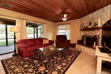 Family room with pine ceiling and fireplace