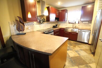 Spacious kitchen with large stainless steel sink,