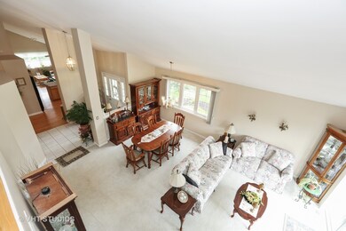 Living Room, Dining Room and Foyer with Vaulted Ce