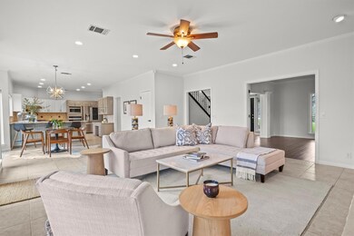 Living room with light tile patterned flooring, r