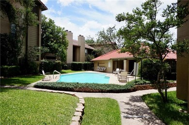 Community pool with a patio area and a yard