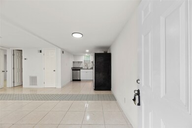One unit features tile flooring and an open-concep
