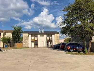 View of building exterior featuring uncovered par