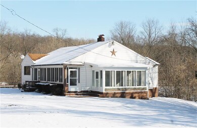 Three sunrooms provide panoramic views of the almo