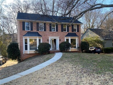 Colonial inspired home with a front lawn