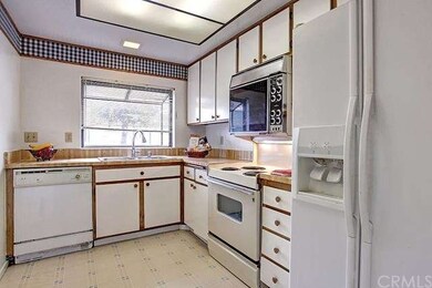 The kitchen has a garden window over the stainless