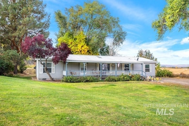 View of front of home featuring a porch and a front yard