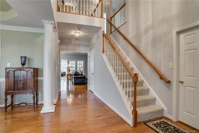 Welcoming 2-story foyer with hardwood flooring. Fo