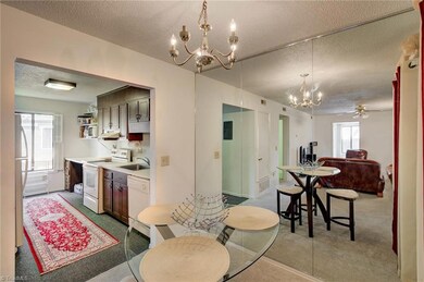 Dining area with kitchen that has nice natural light.