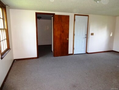Family Room leads to attached garage and mudroom a