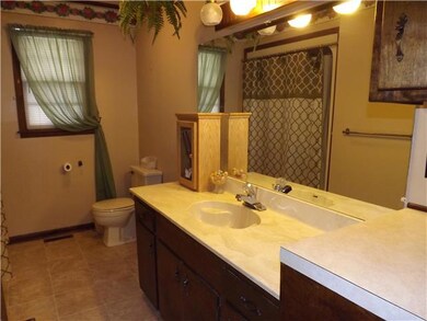 The main bathroom is large and has lots of counter space. 