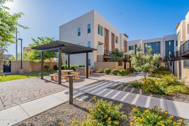 1E ext, NW view (common area BBQ & dog w